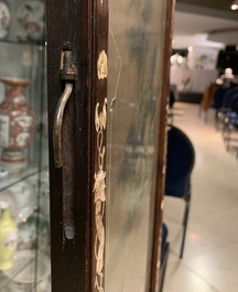 A Chinese mother-of-pearl inlaid wooden screen with silk paintings, 19th C.