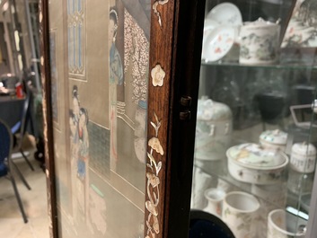 A Chinese mother-of-pearl inlaid wooden screen with silk paintings, 19th C.