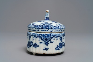 A Dutch Delft blue and white sheep-finial butter tub, 18th C.