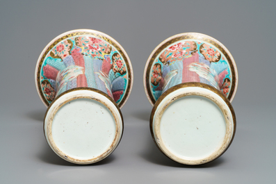 A pair of Chinese famille rose vases with ladies in a garden, Yongzheng