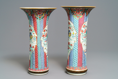 A pair of Chinese famille rose vases with ladies in a garden, Yongzheng
