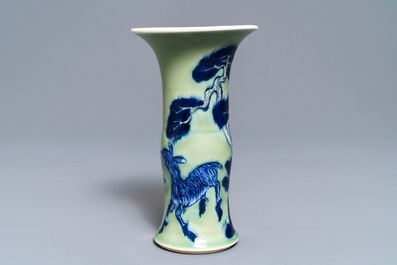 A Chinese blue, white and underglaze red celadon-ground gu vase, Kangxi