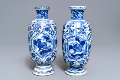 A pair of Chinese blue and white 'mythical beasts' vases, Kangxi