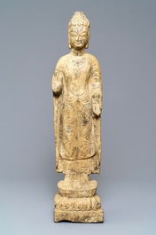 A Chinese carved stone figure of a standing Buddha, Ming or later