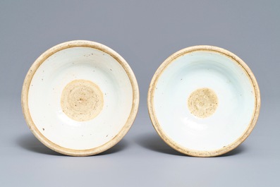 A pair of Chinese blue and white candlesticks, Kangxi/Qianlong