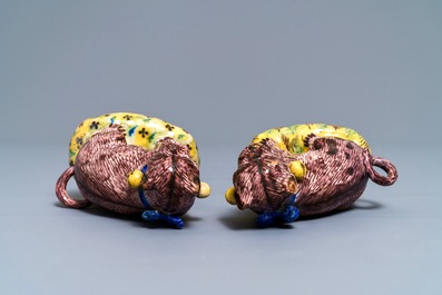 A pair of polychrome Brussels faience models of pugs, 2nd half 18th C.