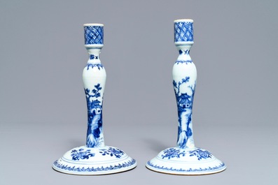 A pair of Chinese blue and white candlesticks, Kangxi/Qianlong