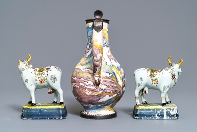 Two pairs of Dutch Delft cows and a pewter-mounted Habaner jug, 18th C.