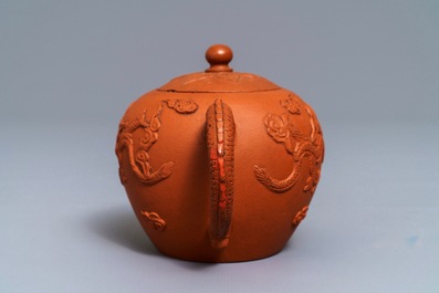 A Chinese Yixing stoneware teapot with applied dragons, Kangxi