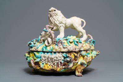 A large and impressive Brussels faience tureen with a lion fighting a dog, 1st half 18th C.