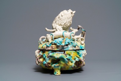 A large and impressive Brussels faience tureen with a lion fighting a dog, 1st half 18th C.