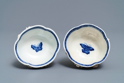 Een paar Chinese blauwwitte 'soft paste' koppen en schotels met reli&euml;fdecor, Qianlong