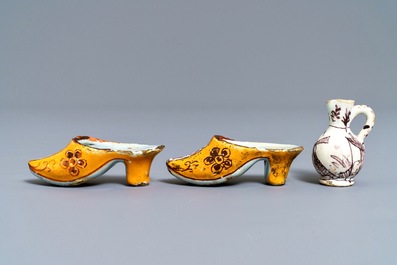 A pair of Dutch Delft polychrome slippers, a miniature jug and a fine lid, 18th C.