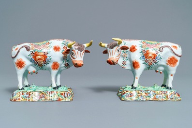 A pair of polychrome petit feu and gilded Dutch Delft models of cows, 1st half 18th C.