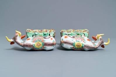 A pair of polychrome petit feu and gilded Dutch Delft models of cows, 1st half 18th C.