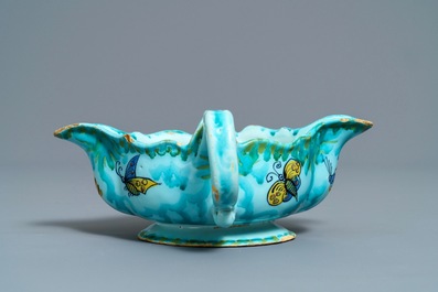 A Brussels faience sauce boat with butterflies and caterpillars, late 18th C.