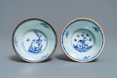 A pair of Chinese blue, white and underglaze red cups and saucers, Kangxi
