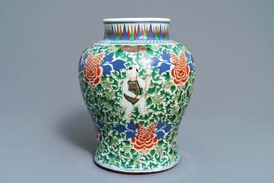 A Chinese wucai 'boys and peony scrolls' vase, 19th C.