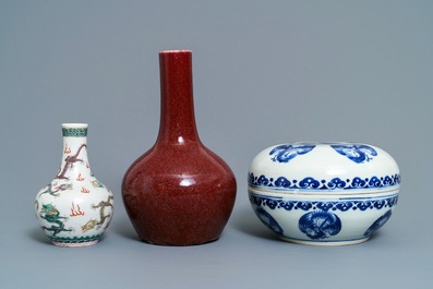 Two Chinese famille verte and sang de boeuf vases and a blue and white 'cranes' box, 19th C.