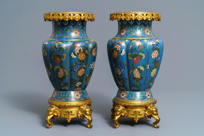 A pair of Chinese gilt bronze mounted cloisonn&eacute; vases, 19th C.