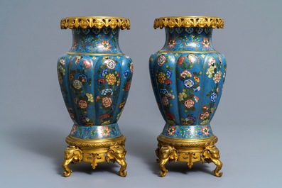 A pair of Chinese gilt bronze mounted cloisonn&eacute; vases, 19th C.