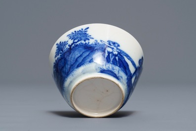 A Chinese blue and white 'soft paste' cup and saucer with an unusual scene with slaves, Qianlong