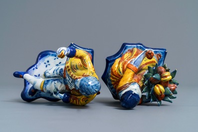 A pair of polychrome Dutch Delft allegorical figures, 18th C.