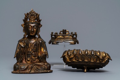 A Chinese gilt-lacquered bronze figure of Guanyin on a lotus throne, Ming