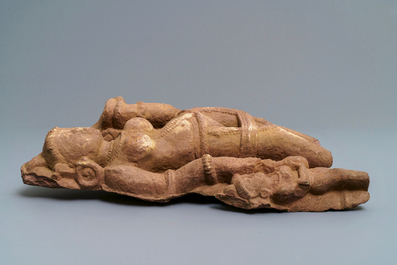A red sandstone fragment of a Yakshi, India, 14th C. or later