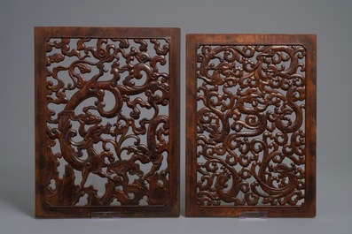 A pair of Chinese reticulated carved wooden panels, 18/19th C.