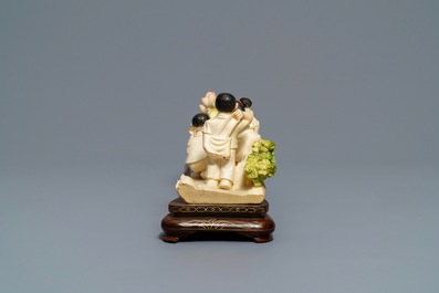 Three polychrome Chinese ivory groups with children, ca. 1940