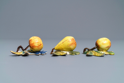 Two polychrome Dutch Delft models of apples and one of a pear, 18th C.