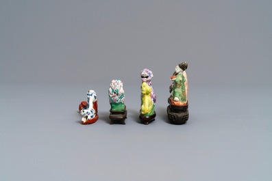 Three Chinese famille rose water droppers and a brush rest, 18/19th C.