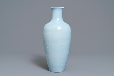 A Chinese monochrome lavender-blue vase with underglaze design, Yongzheng mark, 19th C.
