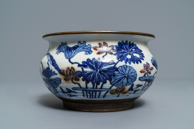 A Chinese blue, white and underglaze red censer, a wall pocket vase and a monochrome blue vase, 19/20th C.