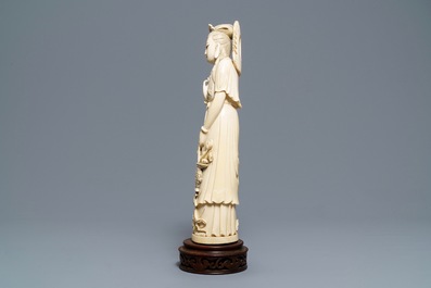 A Chinese ivory figure of Guanyin with a phoenix, ca. 1900