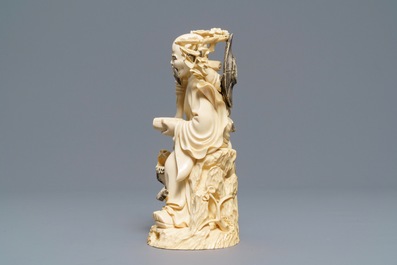 A Chinese ivory group of a sage with a tiger, 19/20th C.