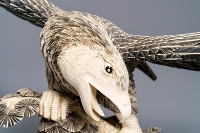 A Chinese carved ivory model of an eagle with a snake, ca. 1930