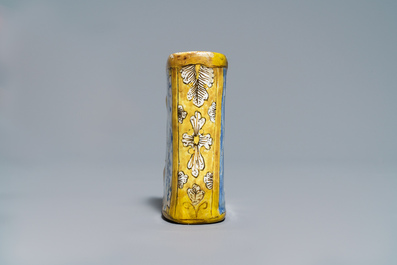 A manganese Dutch Delft miniature stove, a blue and white shell and a French book-shaped handwarmer, 18th C.