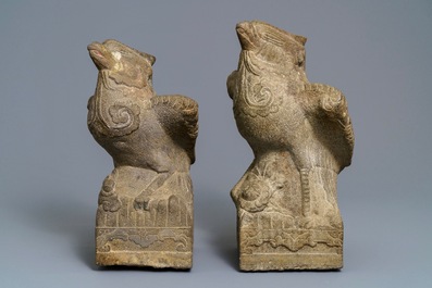 A pair of large Chinese carved stone 'phoenix' figures, Yuan or Ming