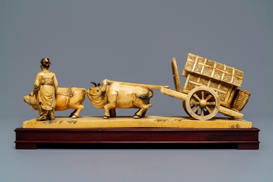 A Chinese carved ivory group of a farmer with buffalo chariot, ca. 1900