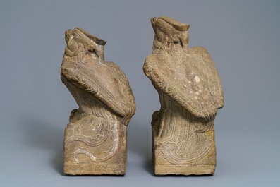 A pair of large Chinese carved stone 'phoenix' figures, Yuan or Ming