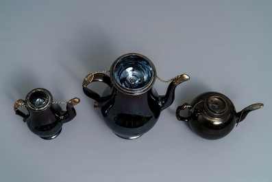 Two silver-mounted Namur black-glazed pottery jugs and a teapot, 18th C.