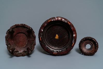 Two Chinese carved bamboo brush pots and five wooden stands, 19/20th C.