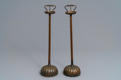 A pair of Japanese bronze shokudai candlesticks and a smaller example, Meiji/Showa, 19/20th C.