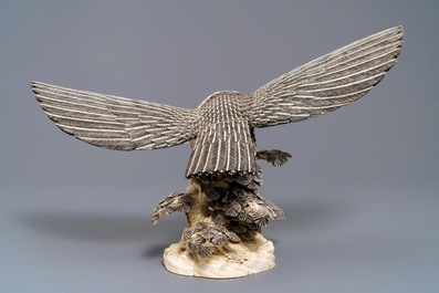 A Chinese carved ivory model of an eagle with a snake, ca. 1930