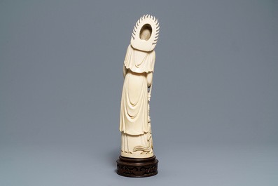 A Chinese ivory figure of Guanyin with a phoenix, ca. 1900