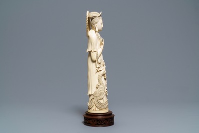 A Chinese ivory figure of Guanyin with a phoenix, ca. 1900