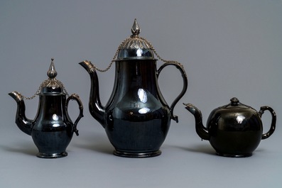 Two silver-mounted Namur black-glazed pottery jugs and a teapot, 18th C.