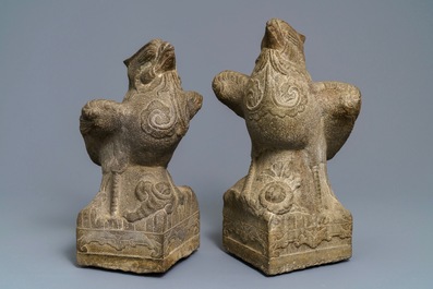 A pair of large Chinese carved stone 'phoenix' figures, Yuan or Ming